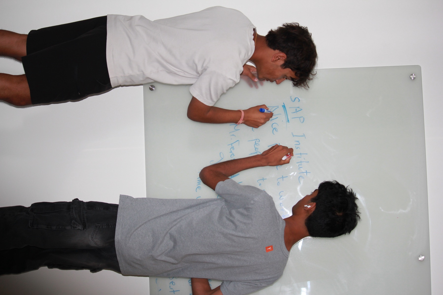 Two students sketch out an idea together at the Dublin hackathon
